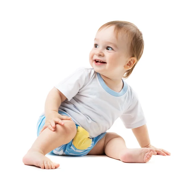 Bebê sentado e olhando para o lado — Fotografia de Stock