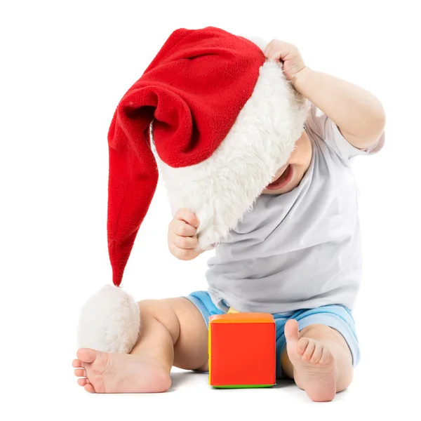 Baby removes his Christmas Hats — Stock Photo, Image