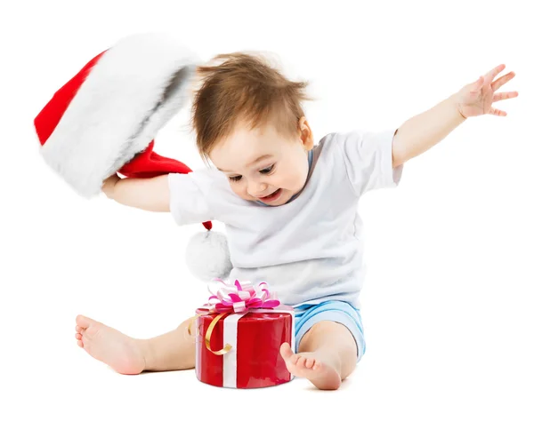 Presentes felizes do bebê no Natal, jogando seu chapéu — Fotografia de Stock