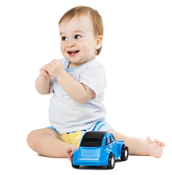 Baby spelen met speelgoed auto 's Stockfoto