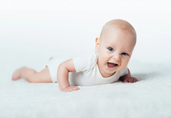 Infant is lying on the carpet — Stock Photo, Image