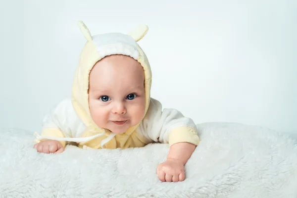 Little baby is smilling in the yellow shirt Stock Photo