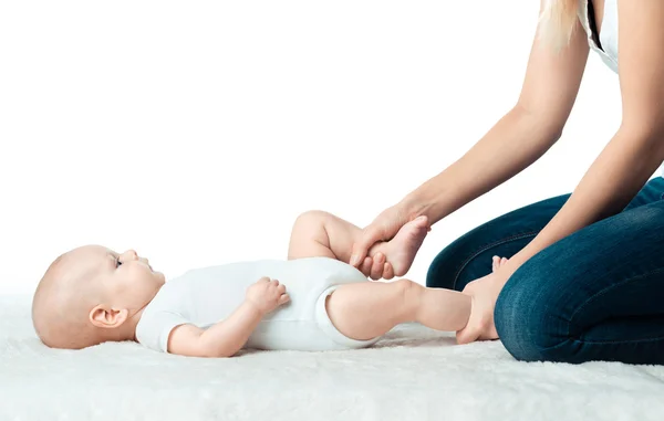 Baby with mum is making massage — Stock Photo, Image