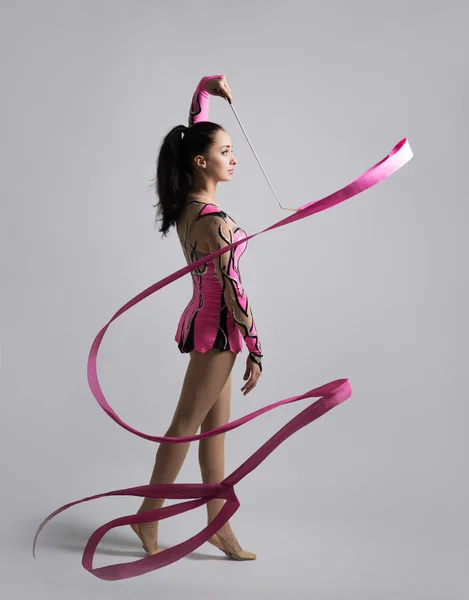 Beautiful Caucasian girl gymnast with a ribbon — Stock Photo, Image