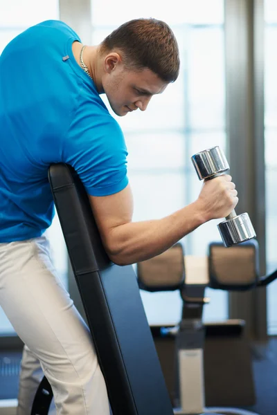 Man doing exercises dumbbells — Stock Photo, Image