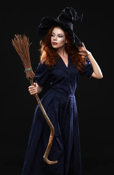 Young beautiful red-haired witch in the dark — Stock Photo, Image
