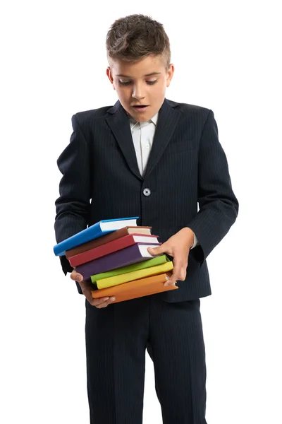 Student druppels een stapel van schoolboeken — Stockfoto