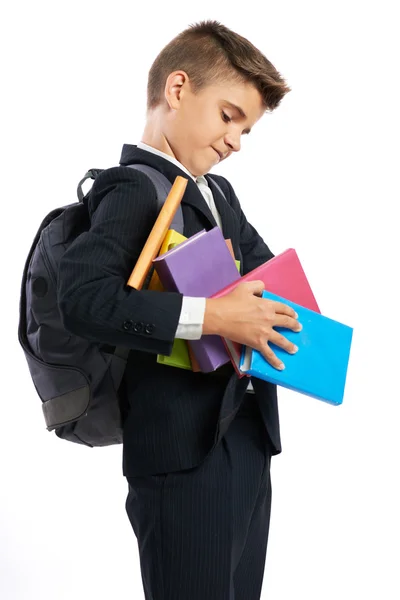 Student druppels een stapel van schoolboeken — Stockfoto