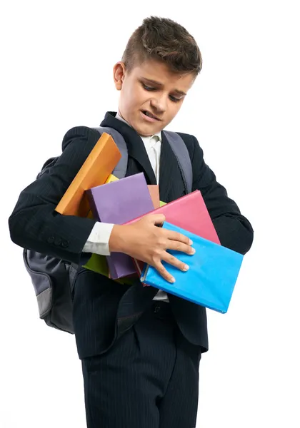 Student druppels een stapel van schoolboeken — Stockfoto