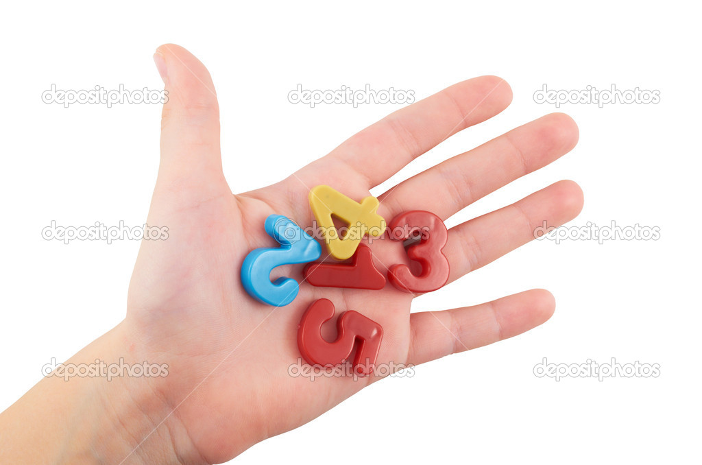Child.A small child's hand holding colorful plastic figures on an isolated white background