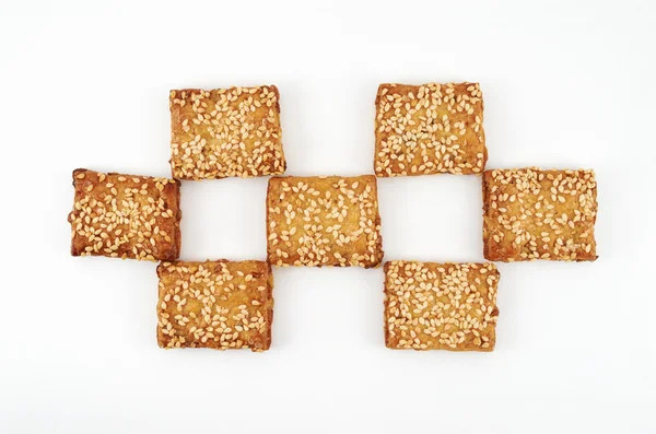 Cookies.Cookies cosparso di sesamo su sfondo bianco — Foto Stock