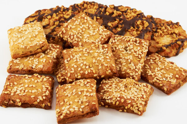 Cookies.A handful of cookies with peanuts and sesame seeds