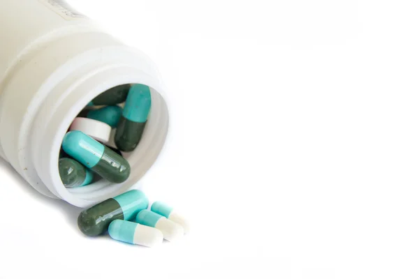 Um punhado de comprimidos coloridos. antecedentes médicos — Fotografia de Stock
