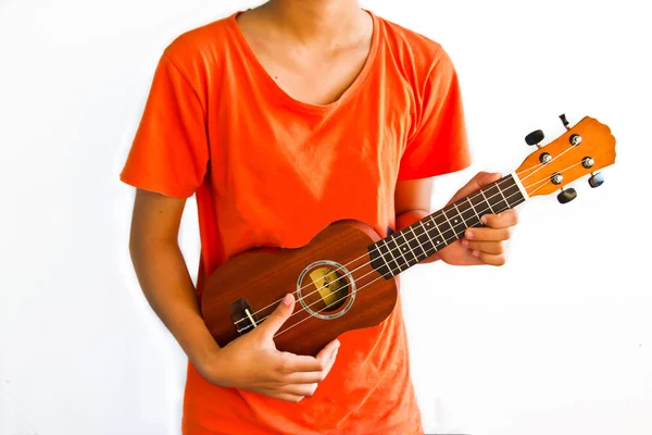 Flicka spela ukulele, närbild i händer — Stockfoto