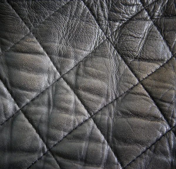 Leather texture colose-up with linear stiches. Part of a leather — Stock Photo, Image