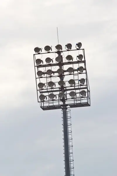 Stadium lights turn on at twilight time — Stock Photo, Image