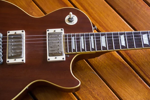 Vintage top guitar on old wood surface. — Stock Photo, Image