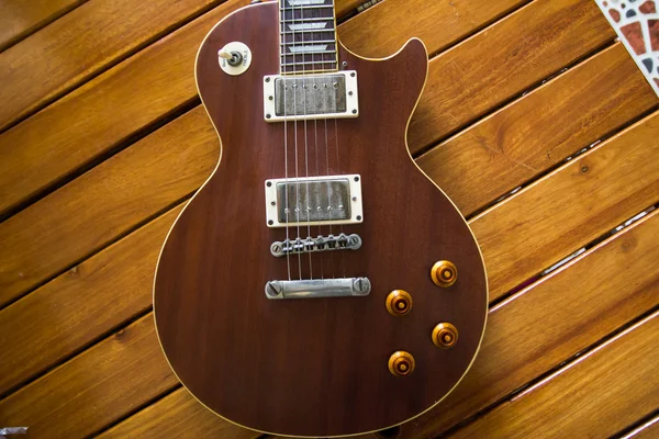 Vintage top guitar on old wood surface. — Stock Photo, Image