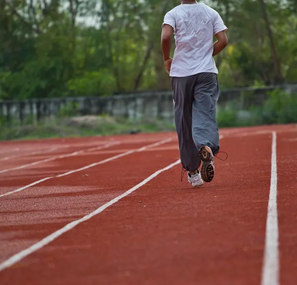 Runner running in the light of evening — Stock Photo, Image