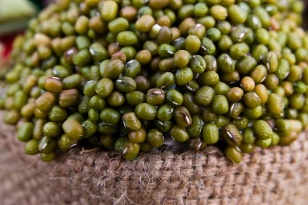 Green mung bean on sack isolated in white background — Stock Photo, Image