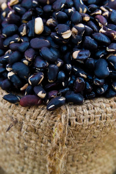 Black beans in a sack — Stock Photo, Image