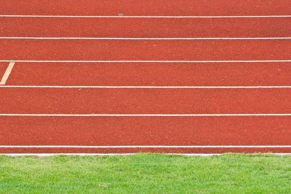 Stadion způsobem mřížky závod tráva — Stock fotografie