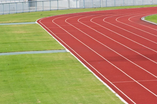 Kurvan för racerbana i stora fotbollsstadion大きなサッカー スタジアムのレース トラックのカーブ — Stockfoto