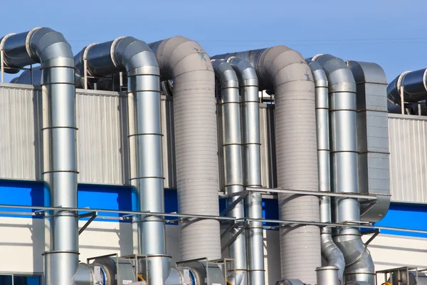 A group pipes and valves in modern factory — Stock Photo, Image