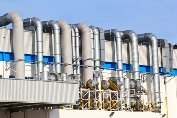 A group pipes and valves in modern factory — Stock Photo, Image