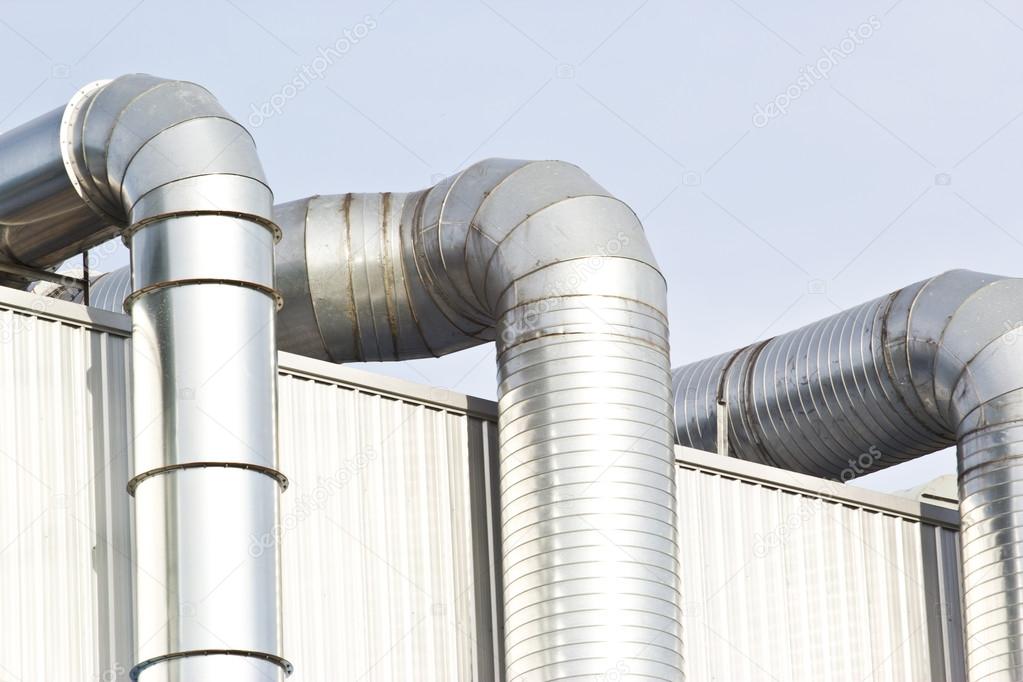 Ventilation pipes of an air conditionon a roof top.