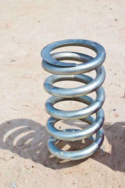 Metal spring detail on white background — Stock Photo, Image