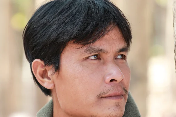 Close-up portrait of a man. Looking up into the corner. — Stock Photo, Image