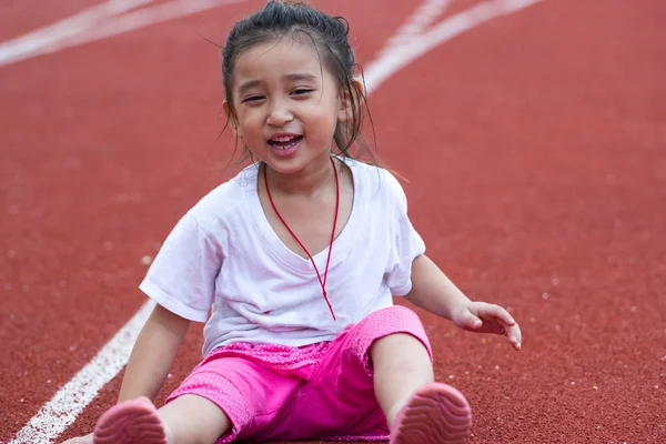 Cheerful girl in sports stadium — Stock Photo, Image