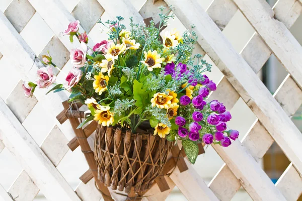 Wall mounted hanging baskets with a range of summer flowers — Stock Photo, Image