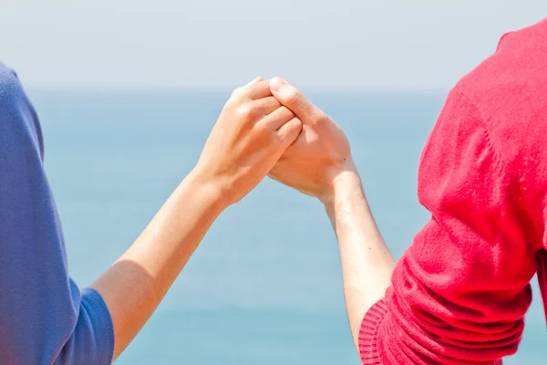 Two hands over thai sea — Stock Photo, Image