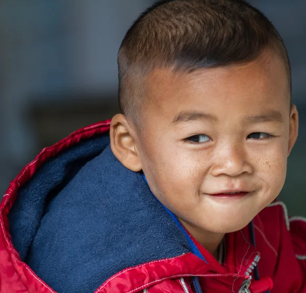 Asian boy on a cold winter day — Stock Photo, Image