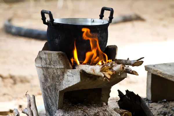 Cook on pot at the charcoal brazier — Stock Photo, Image