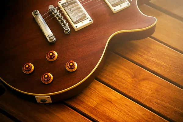 Vintage top guitar on old wood surface. — Stock Photo, Image