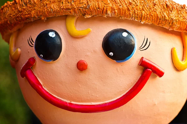 Face of smile baked clay doll, close up — Stock Photo, Image