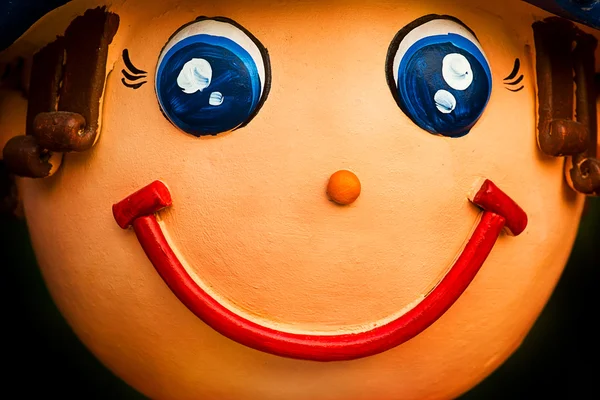 Face of smile baked clay doll, close up — Stock Photo, Image