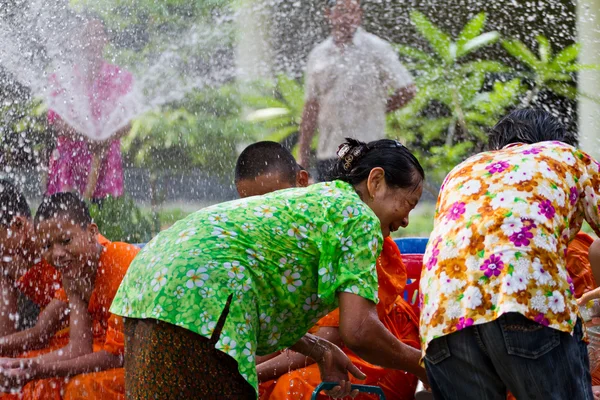 Water pouring to hands monk in Songkran festival on april 13,201 — Stock Photo, Image