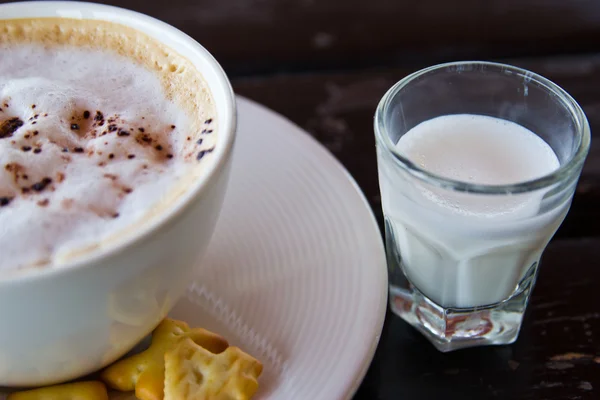 Hot coffee on wooden table — Stock Photo, Image