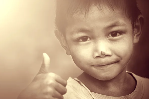 Portrait of beautiful little boy giving you thumbs up over white — Stock Photo, Image