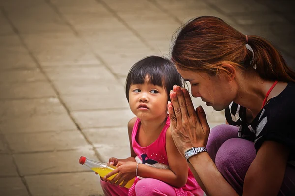 Closeup portrait ofyoung asian woman praying — Stock Photo, Image