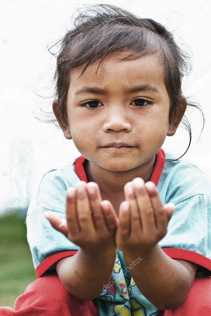 Closeup portrait of young asian woman praying