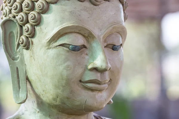 Budda twarz przez wosk — Zdjęcie stockowe