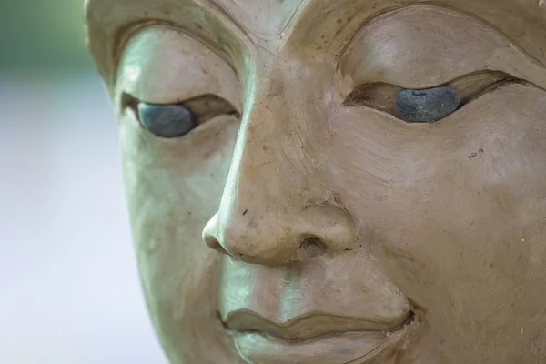 buddha face by wax