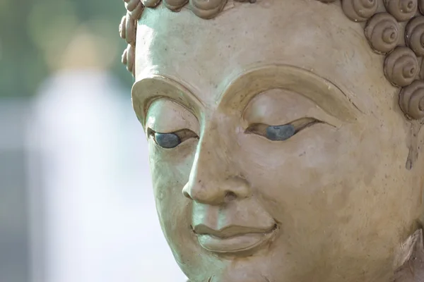 buddha face by wax