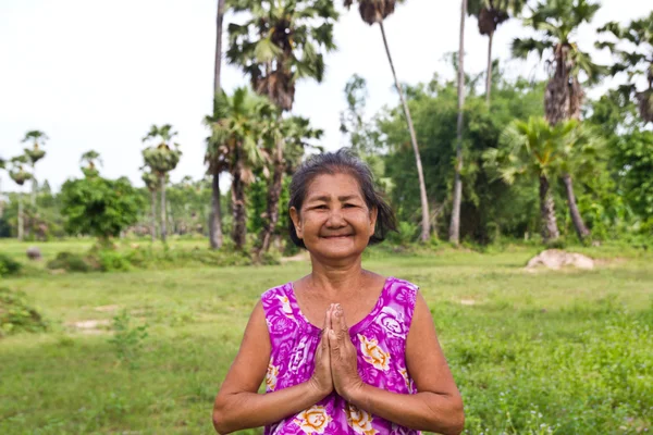 Portrait of  smiling elderly woman — Stock Photo, Image