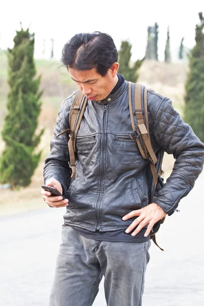 Mobile phone camera in male hand — Stock Photo, Image